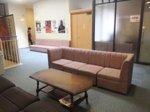 Un lugar para sentarse en Natural Onsen Hostel Hidamari no Yu