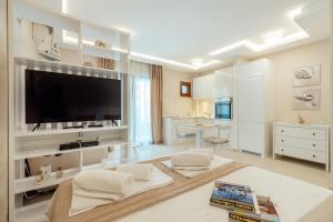 a living room with a large flat screen tv at Apartments Dabinovic in Kotor