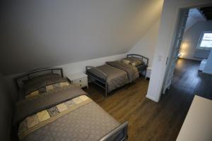 A bed or beds in a room at Eine sehr gemütliche Dachgeschoß Ferienwohnung