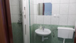 a bathroom with a sink and a toilet and a shower at Leśne Zacisze in Weremień +80 photos