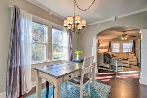 a dining room with a wooden table and chairs at Modern Florence Getaway with Patio and Grill! in Florence