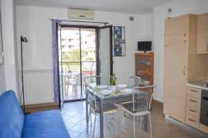 A kitchen or kitchenette at Homiday - Residence Micaene