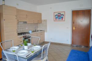 A kitchen or kitchenette at Homiday - Residence Micaene