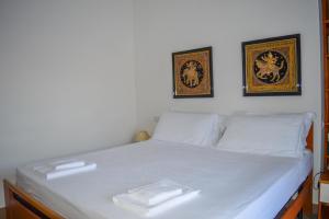A bed or beds in a room at Homiday - Residence Micaene