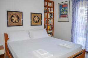 A bed or beds in a room at Homiday - Residence Micaene