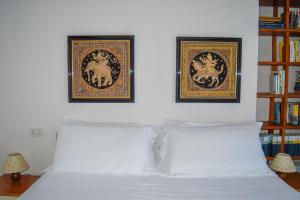 A bed or beds in a room at Homiday - Residence Micaene
