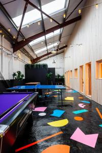 a ping pong room with ping pong tables at CoalShed in Bristol