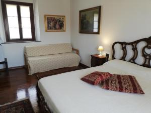 Кровать или кровати в номере La Foresteria dei Baldi