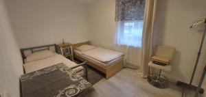 Postel nebo postele na pokoji v ubytování Outletcity Ferienwohnung - Apartment 4