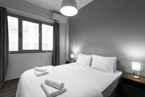 Posteľ alebo postele v izbe v ubytovaní Aelia Apartments, The Luxury Suites
