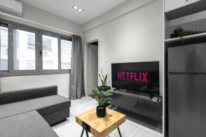 A television and/or entertainment centre at Aelia Apartments, The Luxury Suites