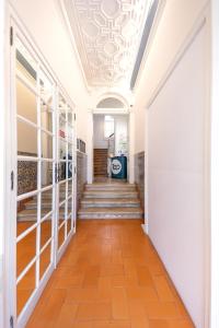 a hallway with a staircase and a ceiling at TOP Coimbra in Coimbra