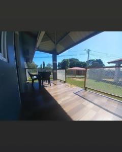 a view of a patio with a table and a fence at My little house in David