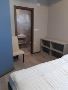 Posteľ alebo postele v izbe v ubytovaní Apartment Lizzi.