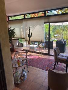 a living room with a view of a living room at Villa des Roses in Roussillon
