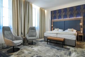 En eller flere senger på et rom på Hotel Galant Mikulov