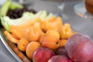 a tray full of fruit on a table at Hotel Perla Dello Ionio in Torre Lapillo +13 photos