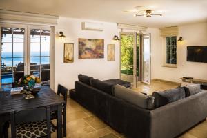 a living room with a couch and a table at Villa Marlin in Kalkan