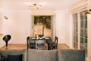a living room with a table and a couch at Villa Marlin in Kalkan
