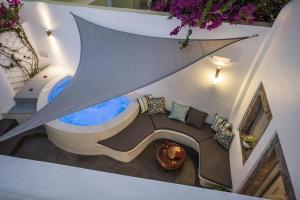 an overhead view of a bathroom with a tub at Angels Villa Santorini in Megalochori