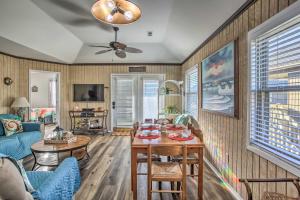 a living room with a couch and a table at Walk to Beach Dog-Friendly Myrtle Beach Cottage! in Myrtle Beach