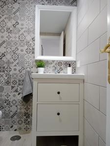 a bathroom with a white sink and a mirror at MI ALMA in Puerto del Carmen