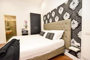 A bed or beds in a room at NAVONA VITA SUITES