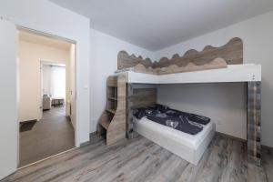 Posteľ alebo postele v izbe v ubytovaní Apartmán Pod Sněžníkem