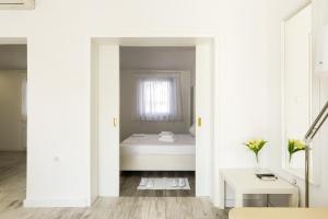 Postel nebo postele na pokoji v ubytování Apartments Villa Pina