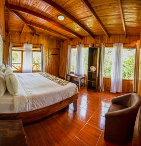 מיטה או מיטות בחדר ב-Hotel Holístico Monteverde