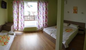 Postel nebo postele na pokoji v ubytování Guest House Rosa