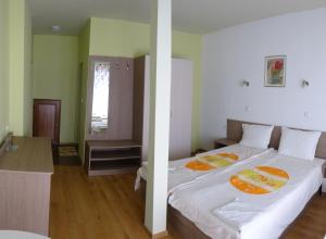 Postel nebo postele na pokoji v ubytování Guest House Rosa