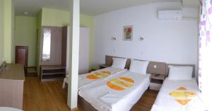 Postel nebo postele na pokoji v ubytování Guest House Rosa