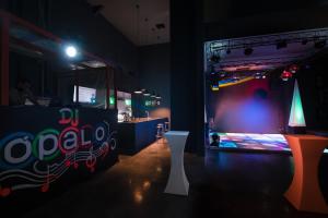 a room with a stage with a soda sign on it at Impressive Punta Cana - All Inclusive in Punta Cana