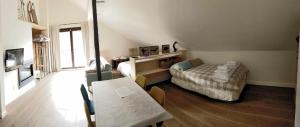 a room with a bed and a table in it at Casa Cotefablo. Aloj Sorrosal (Gavin, Biescas) in Gavín