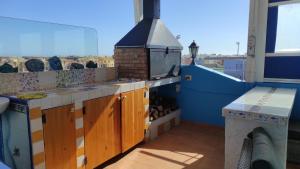 Fotografia z galérie ubytovania Ático Arinaga con vistas , jacuzzi , terraza y barbacoa v destinácii Arinaga