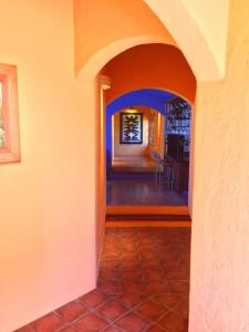 a hallway of a house with an arch way at John’s Home on Wine Route in Ciudad Lujan de Cuyo