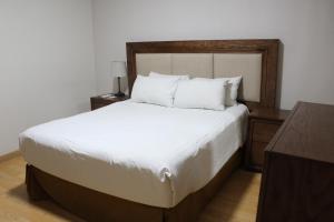Postel nebo postele na pokoji v ubytování Hotel Adriana
