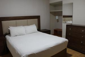 Postel nebo postele na pokoji v ubytování Hotel Adriana