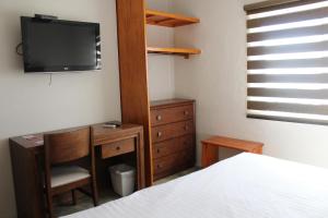 Postel nebo postele na pokoji v ubytování Hotel Adriana