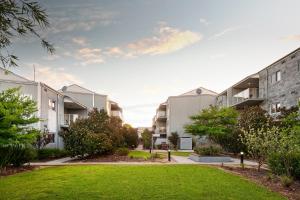 an image of an apartment complex with a lawn at Airport Apartments by Vetroblu in Perth