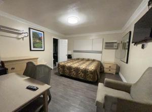 Postel nebo postele na pokoji v ubytování Flamingo Motel Oxnard
