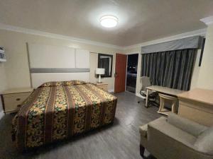 Postel nebo postele na pokoji v ubytování Flamingo Motel Oxnard