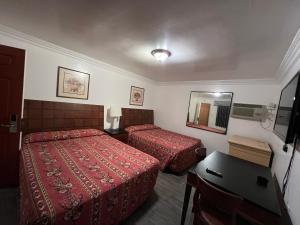 Postel nebo postele na pokoji v ubytování Flamingo Motel Oxnard
