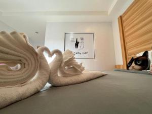 Postel nebo postele na pokoji v ubytování Cat Story Hotel