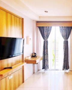 TV a/nebo společenská místnost v ubytování Cat Story Hotel