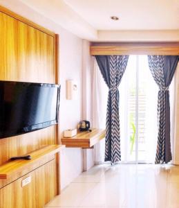 TV a/nebo společenská místnost v ubytování Cat Story Hotel
