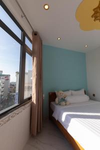 Postel nebo postele na pokoji v ubytování 26 Topaz Hotel