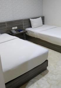 Letto o letti in una camera di Tulip Guest House
