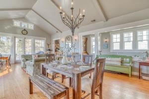 a dining room and living room with a table and chairs at Mill House in Lincoln City